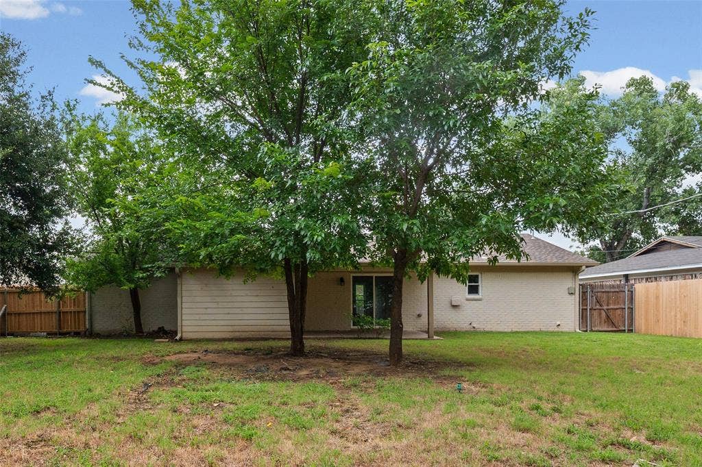 1005 Keller Avenue, Benbrook, TX 76126 Mature trees help provide shade for those sunny summer days.