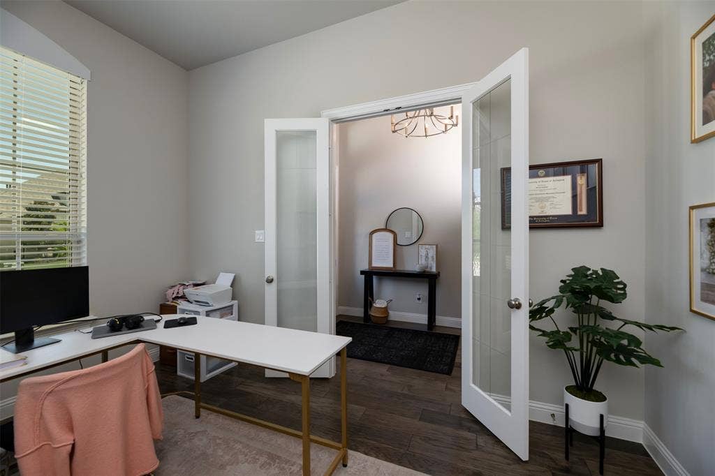 1109 10th Street, Argyle, TX 76226 Vaulted ceilings enhance this space featuring wood-finish flooring and neutral wall tones