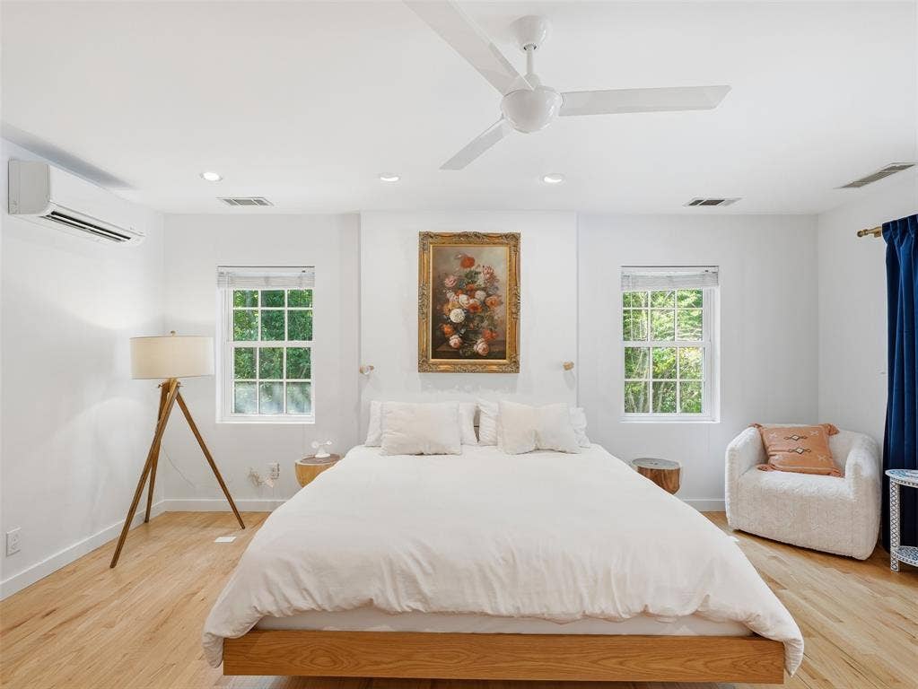 Bedroom featuring light wood-finish flooring, recessed lighting, and a ceiling fan