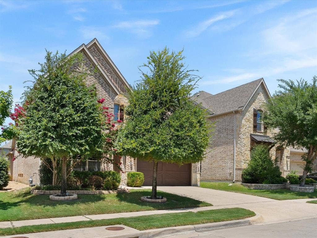 2703 Navarro Trail, Euless, TX 76039 Brick and stone façade with a gabled roofline