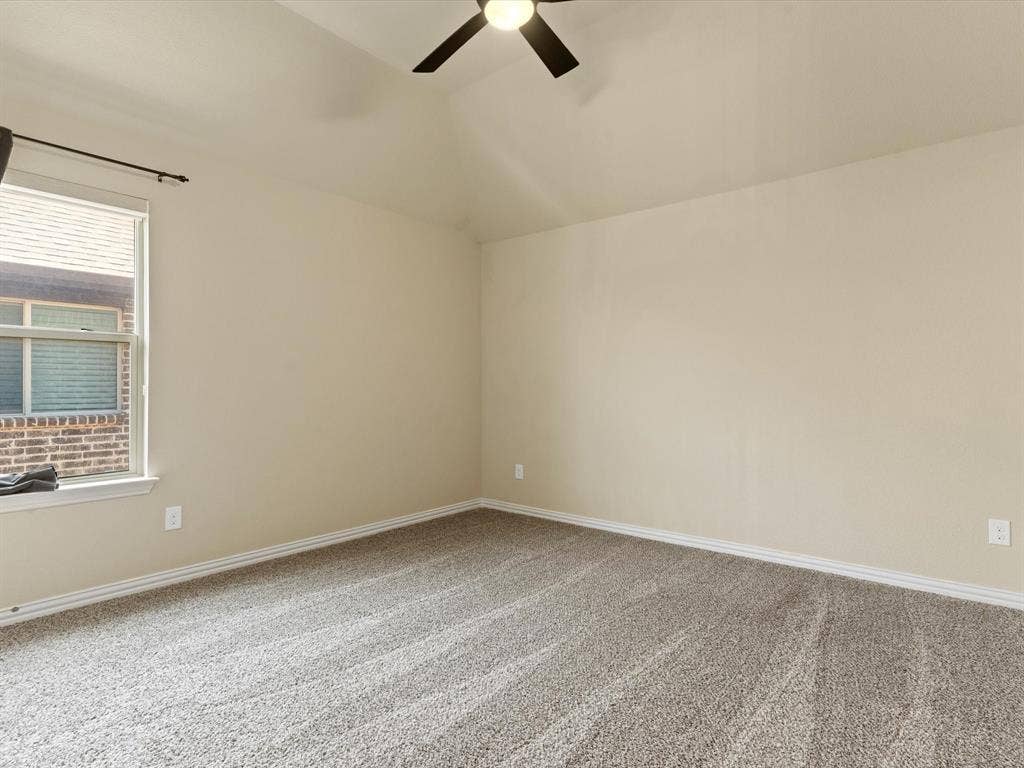 2703 Navarro Trail, Euless, TX 76039 Spacious room featuring vaulted ceilings, neutral wall tones, plush carpet flooring, second floor