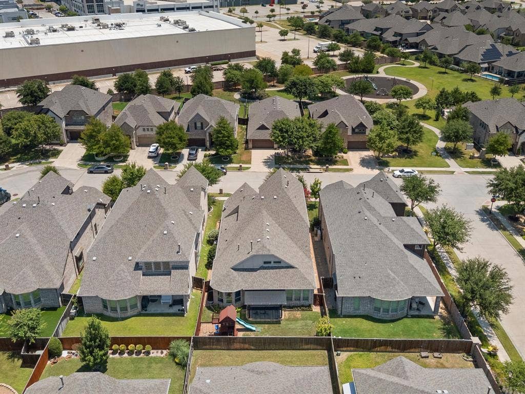 2703 Navarro Trail, Euless, TX 76039 Aerial perspective showcasing a residential community with asphalt shingle roofs