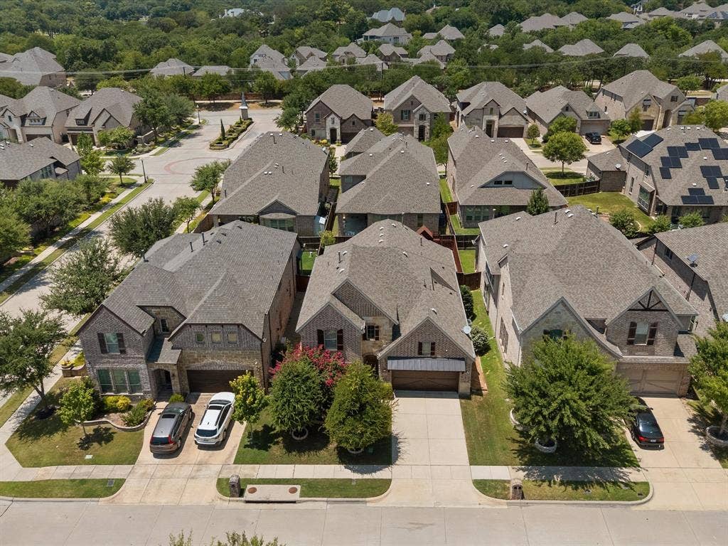 2703 Navarro Trail, Euless, TX 76039 Aerial perspective showcasing a residential street with uniform architecture