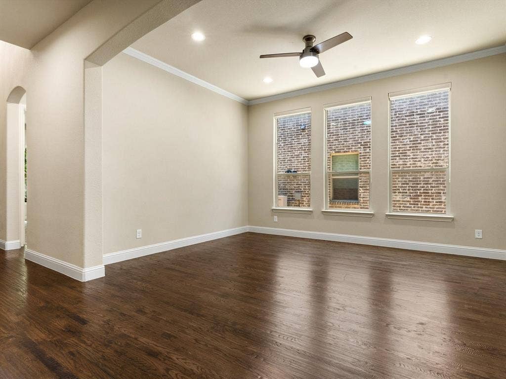 2703 Navarro Trail, Euless, TX 76039 Dining Room/ or Extra Living Room featuring wood-finish flooring, and a ceiling fan with dark blades