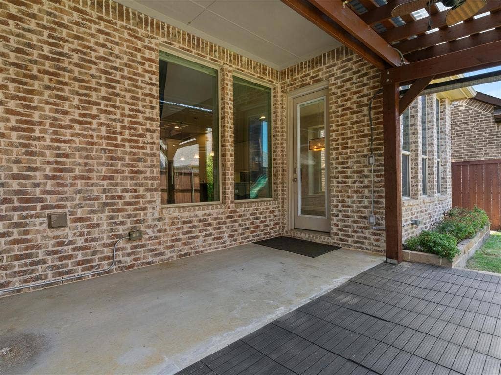 2703 Navarro Trail, Euless, TX 76039 Covered patio featuring a concrete slab and interlocking deck tiles
