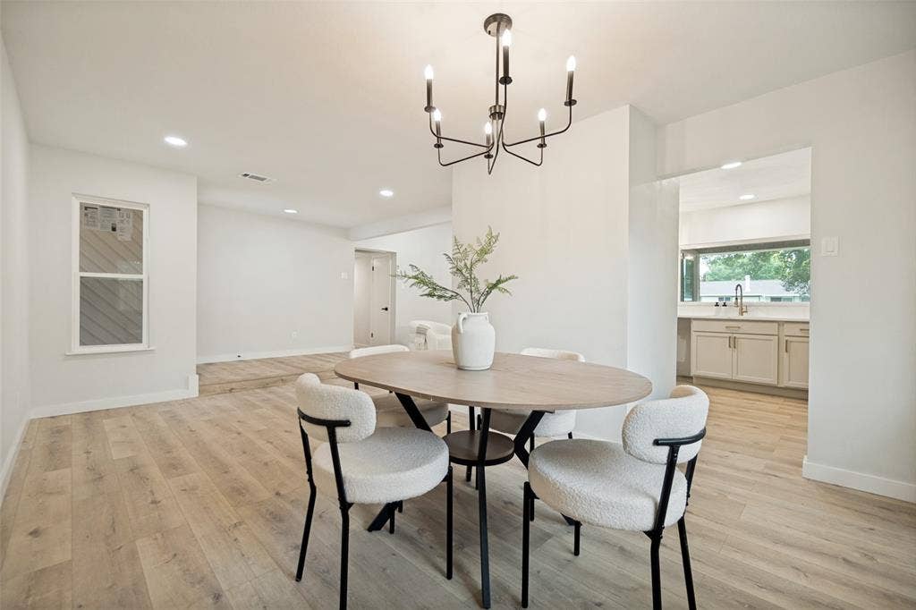641 Stroud Lane, Garland, TX 75043 Dining area featuring light wood-finish flooring, a contemporary chandelier, and recessed lighting