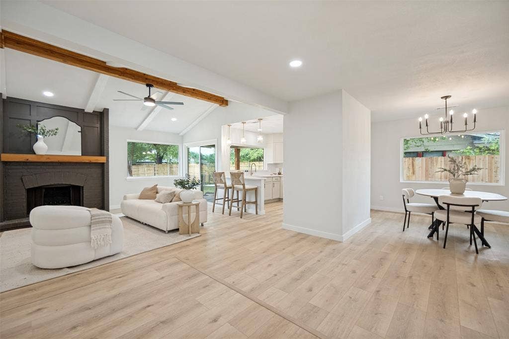 641 Stroud Lane, Garland, TX 75043 Vaulted ceilings with exposed wood beams highlight this expansive living area