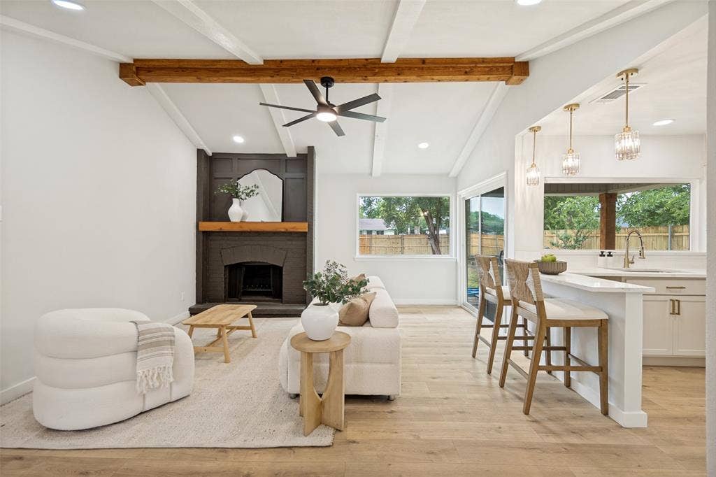 641 Stroud Lane, Garland, TX 75043 Vaulted ceiling with exposed wood beams and ceiling fan