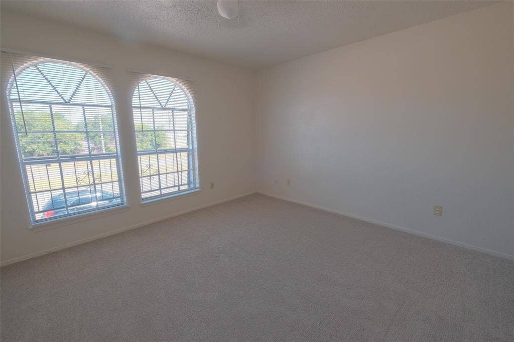 6317 Granbury Road, #6321, Fort Worth, TX 76133 Spacious room featuring neutral carpeting and light-colored walls