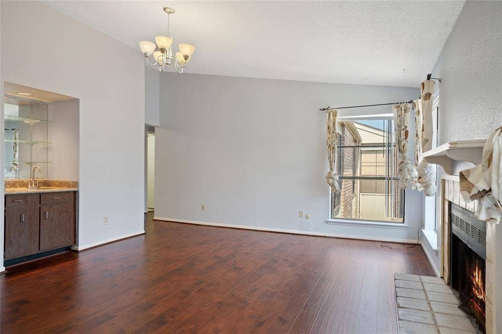 8100 Cambridge Street, #124, Houston, TX 77054 Open living area featuring rich wood-finish flooring