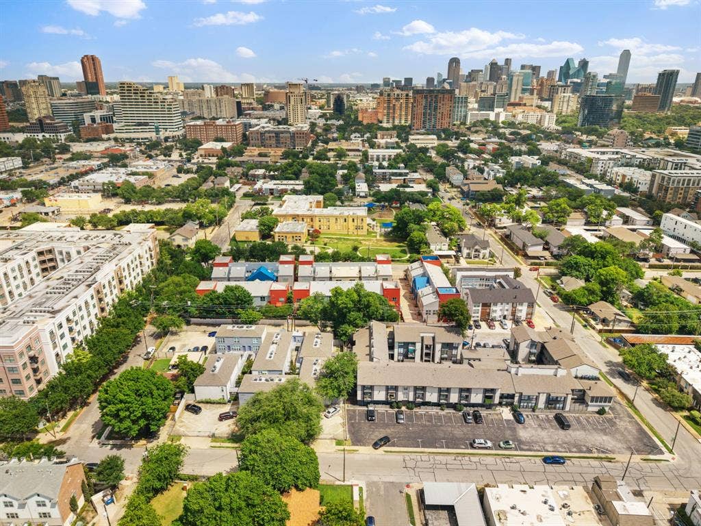 Aerial perspective showcasing urban density with a prominent city skyline