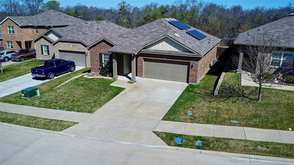 741 Windsor Court, Lavon, TX 75166 Brick exterior with a gabled roof and attached garage