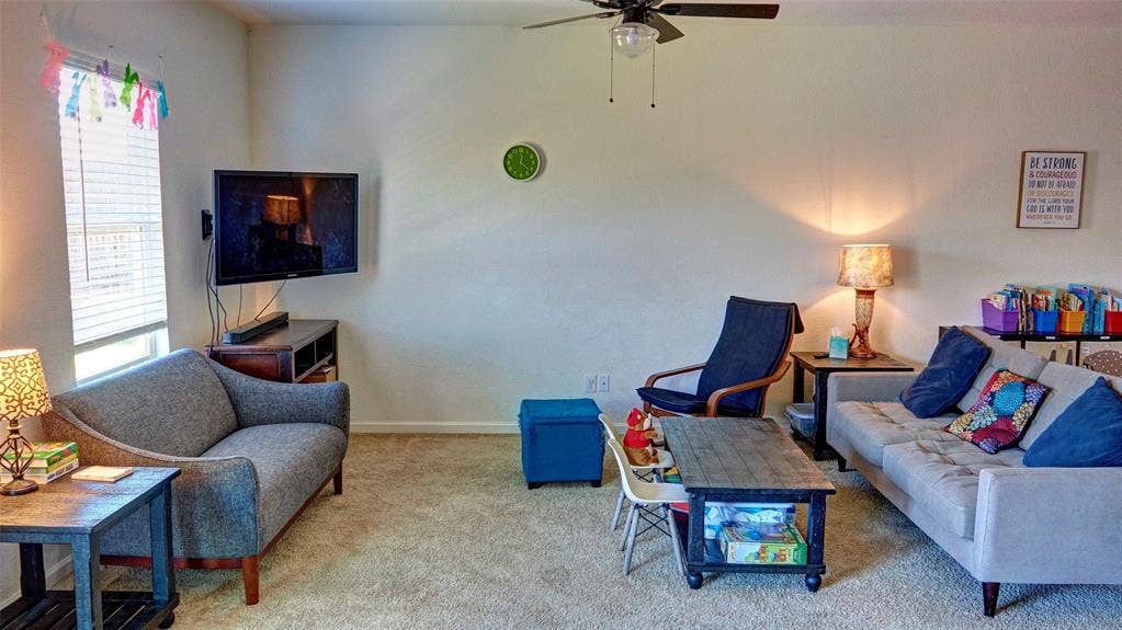 741 Windsor Court, Lavon, TX 75166 Carpet flooring, ceiling fan, and window with blinds