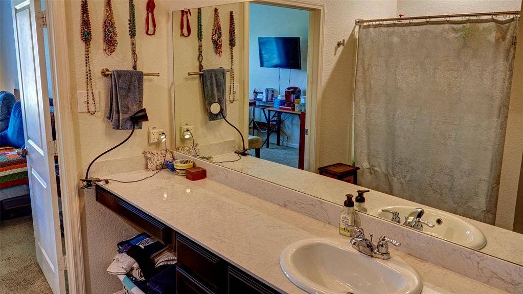741 Windsor Court, Lavon, TX 75166 Extended vanity with an integrated sink and chrome faucet