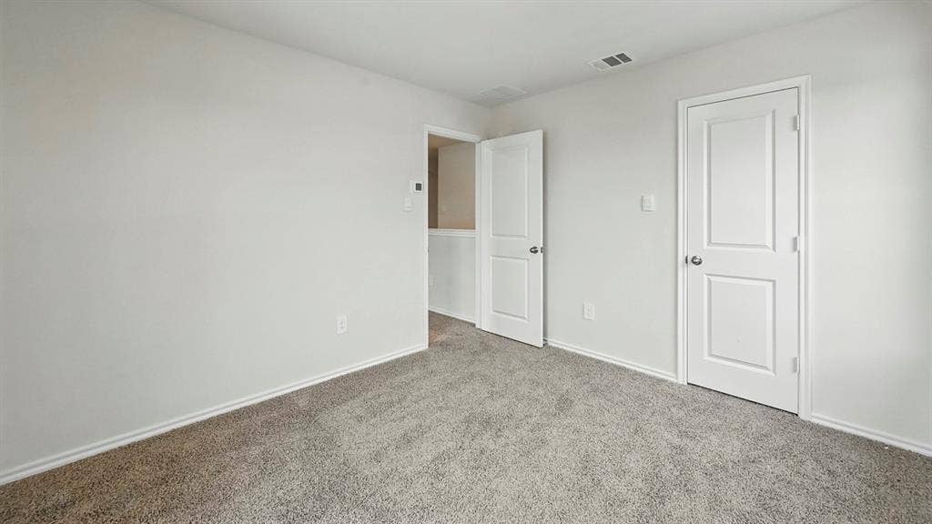 5602 Gannet Place, Crandall, TX 75114 Spacious room featuring neutral carpeting and white baseboards