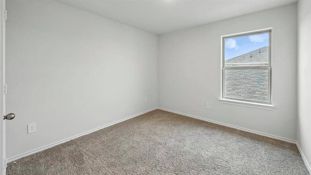 5602 Gannet Place, Crandall, TX 75114 Carpeted interior room featuring a single window with white trim, light gray walls, and white baseboards