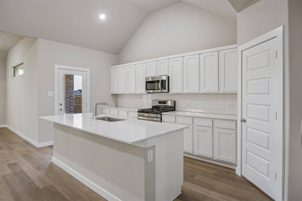 4016 Somerville Drive, Farmersville, TX 75442 Kitchen in the Wimbledon home plan by Trophy Signature Homes – REPRESENTATIVE PHOTO