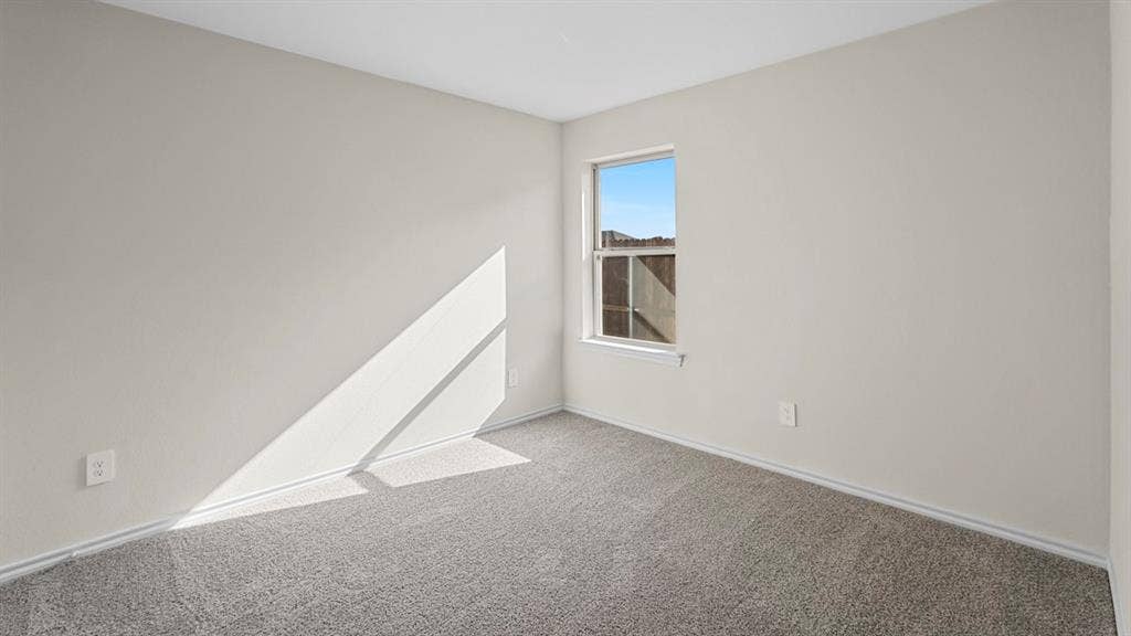 2912 Peppergrass Street, Royse City, TX 75189 Neutral-toned room featuring a single window, light-colored walls, gray carpeting, and white baseboards