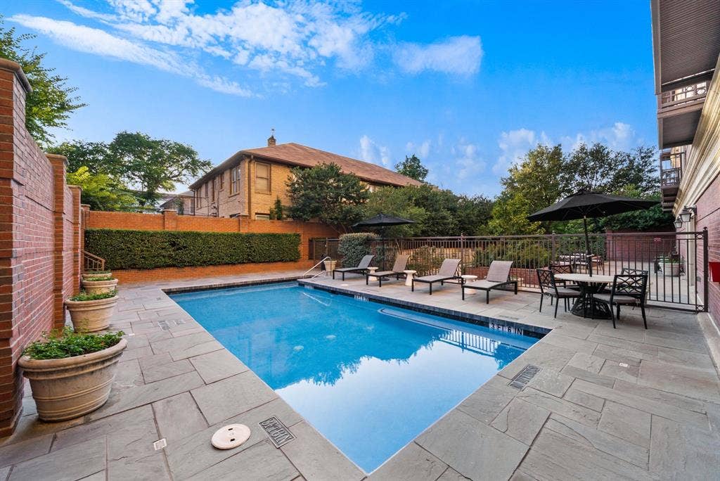 4240 Prescott Avenue, #8B, Dallas, TX 75219 Outdoor swimming pool with a surrounding stone patio