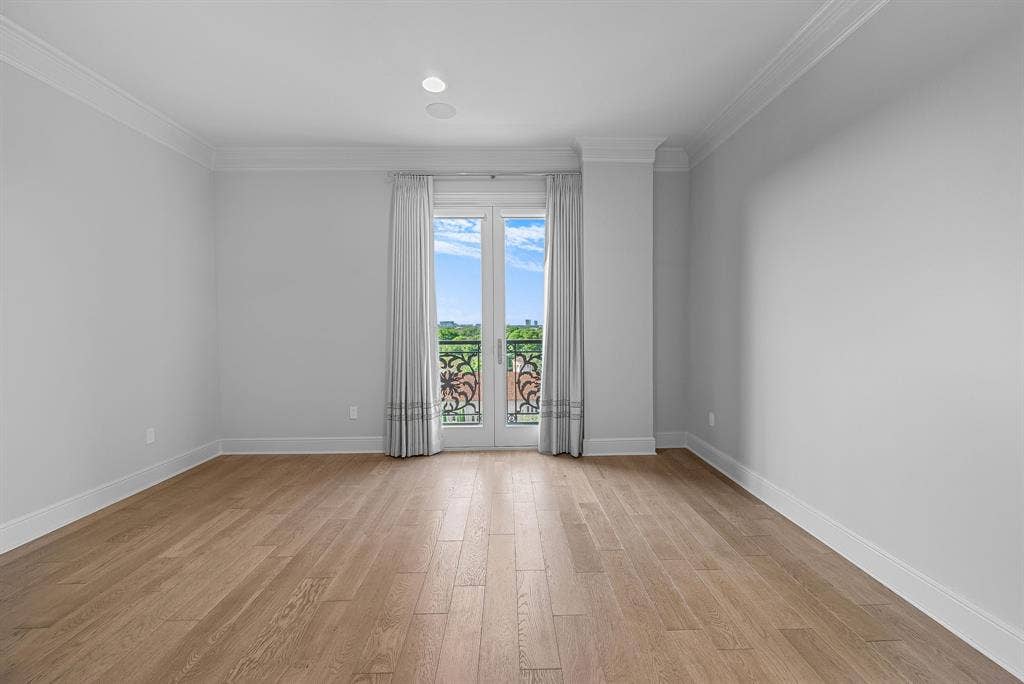 4240 Prescott Avenue, #8B, Dallas, TX 75219 Light wood-finish flooring complements neutral wall tones