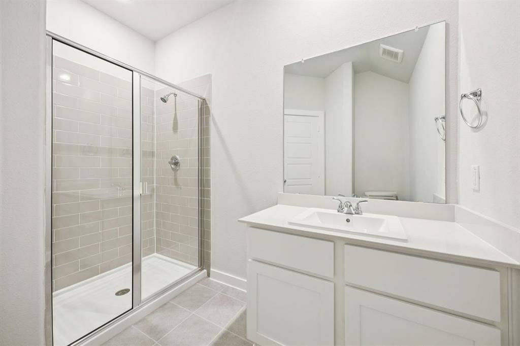 Bathroom in the Masters home plan by Trophy Signature Homes – REPRESENTATIVE PHOTO