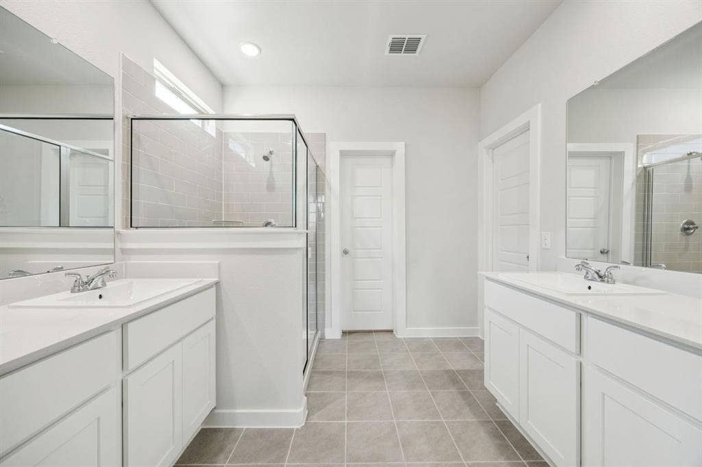 Primary Bathroom in the Masters home plan by Trophy Signature Homes – REPRESENTATIVE PHOTO