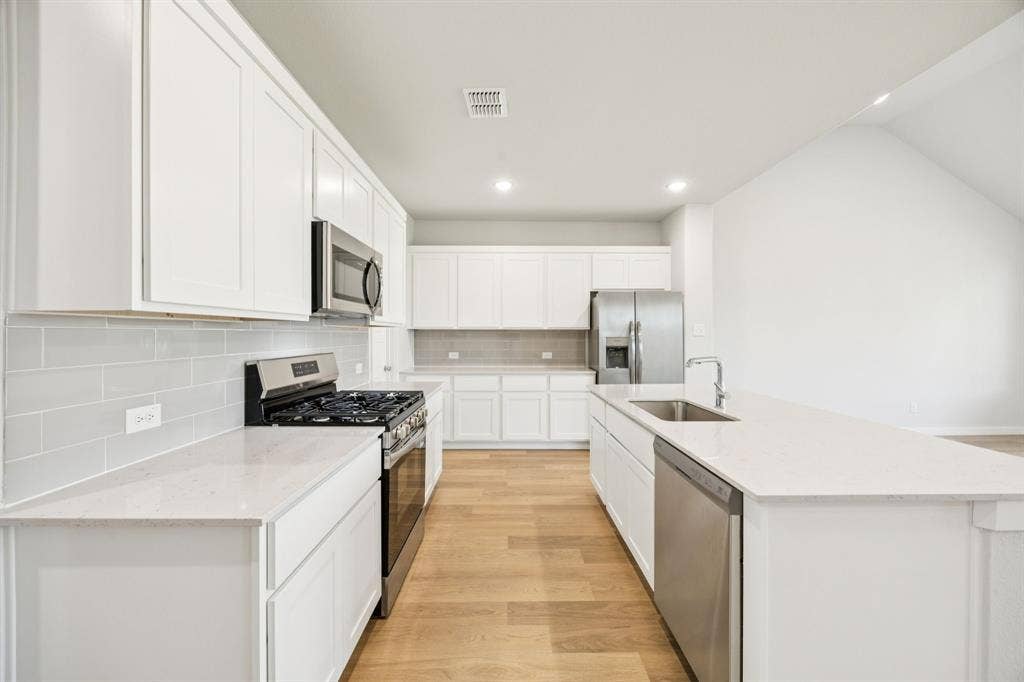 2029 Chariot Court, Seagoville, TX 75159 Kitchen in the Masters home plan by Trophy Signature Homes – REPRESENTATIVE PHOTO