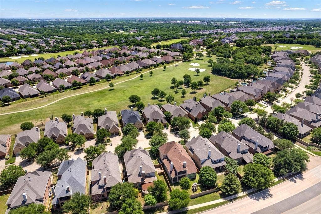 Residential community with extensive green spaces and mature trees