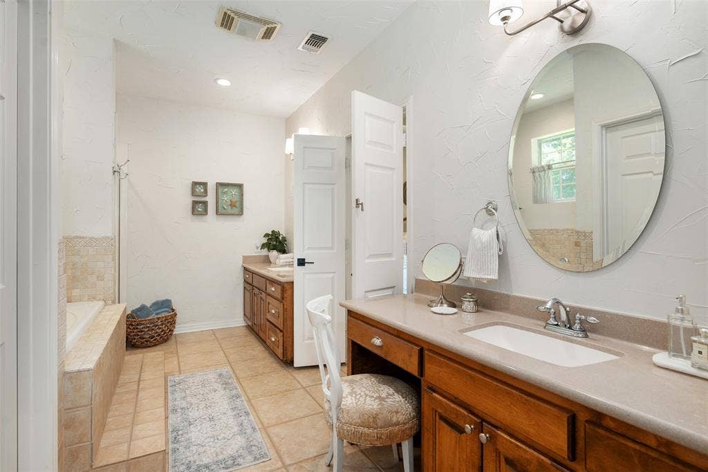 Primary bathroom with dual vanities