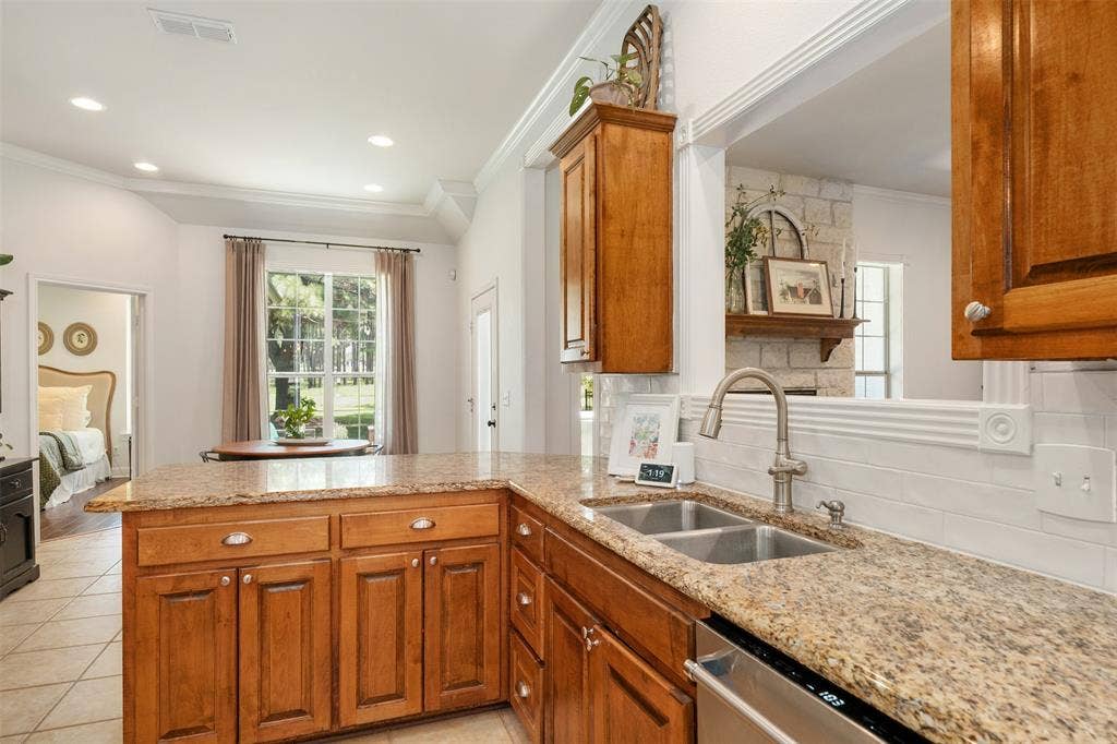 kitchen looking to breakfast area and backyard.
