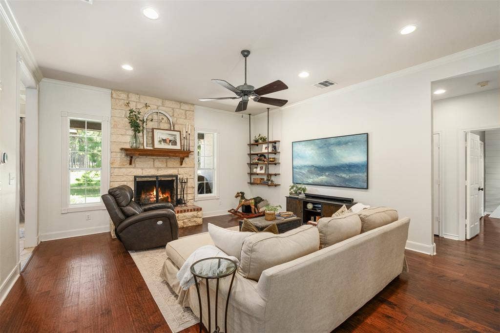 open living area with wood burning fireplace