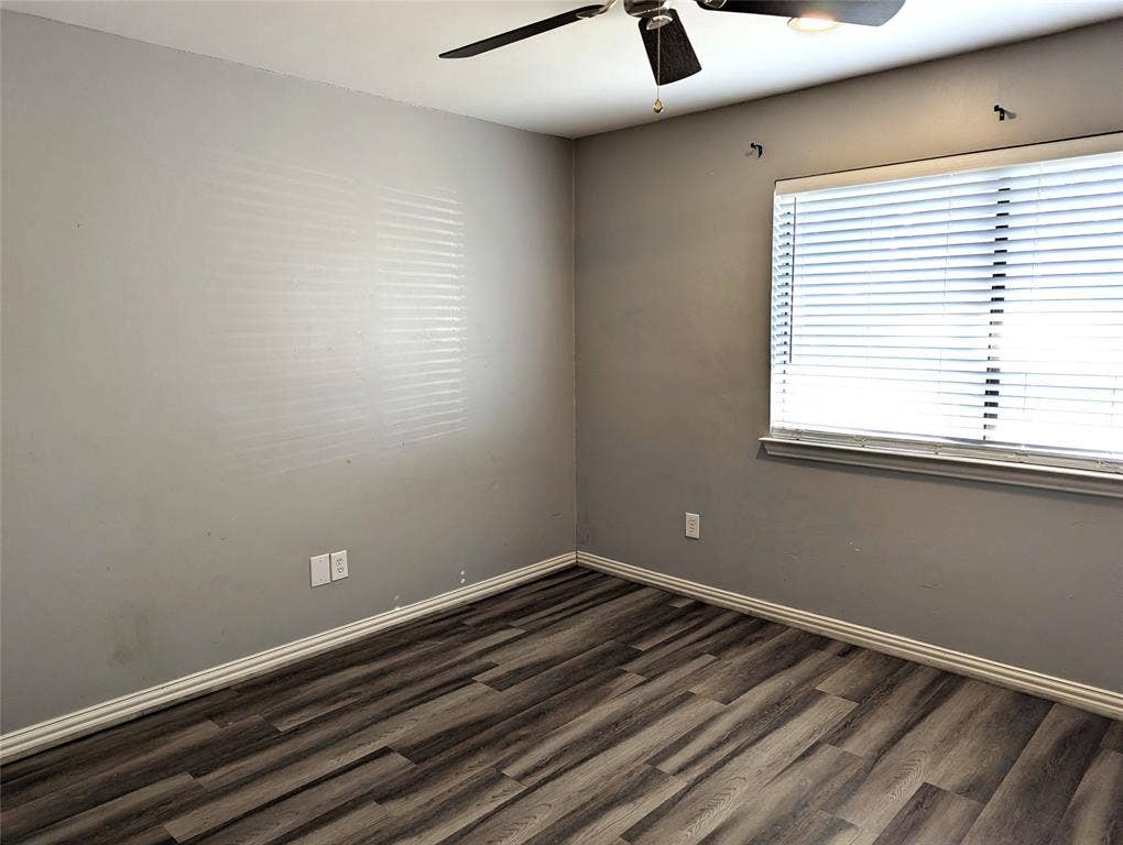509 Pine Trail Drive, Allen, TX 75002 Wood-finish flooring, ceiling fan with integrated lighting, window with blinds, and light gray wall paint