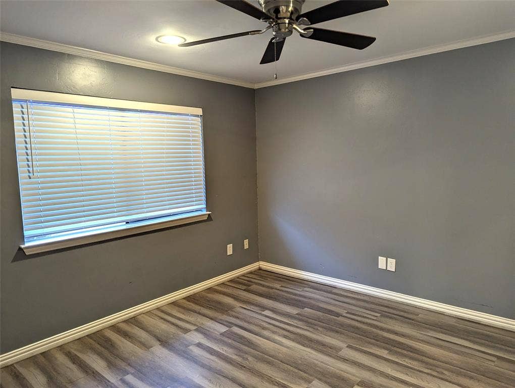 509 Pine Trail Drive, Allen, TX 75002 Wood-finish flooring, crown molding, ceiling fan, recessed lighting, and window blinds