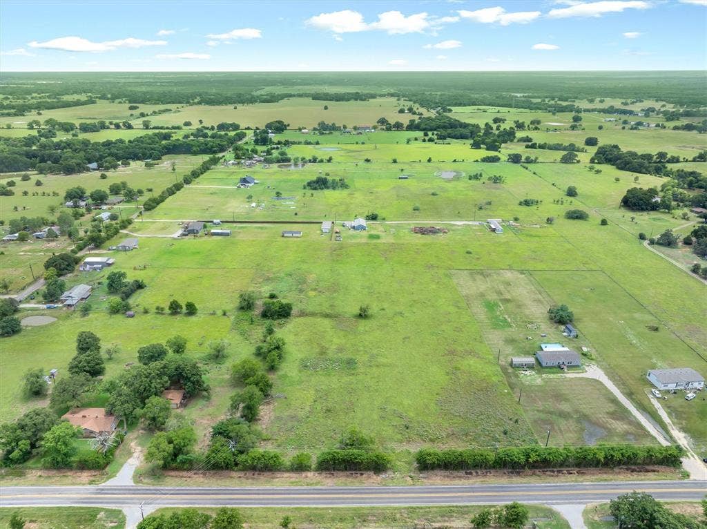 Lot 3R W. Cedar PKWY, Kemp, TX 75143 Expansive aerial property featuring vast green acreage, scattered mature trees, and visible road frontage
