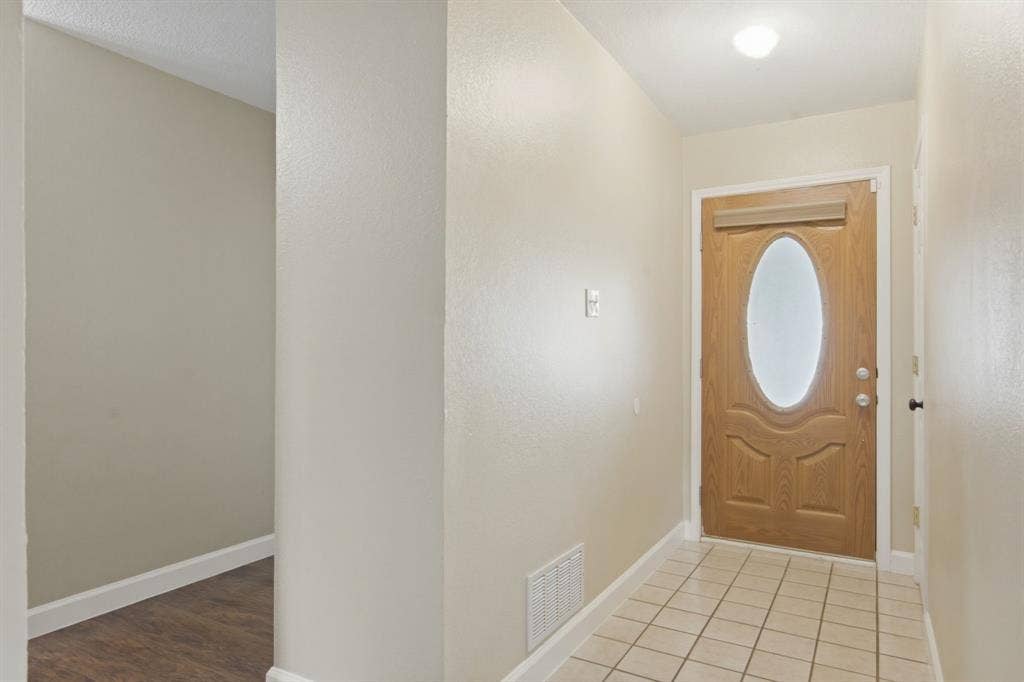 2502 Cranberry Lane, Euless, TX 76039 heading back toward the bedrooms to the left