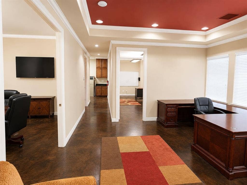 305 W Spring Creek Parkway, #5A, Plano, TX 75023 Spacious interior featuring a distinctive tray ceiling with recessed lighting, dark wood-finish flooring, and multiple open doorways