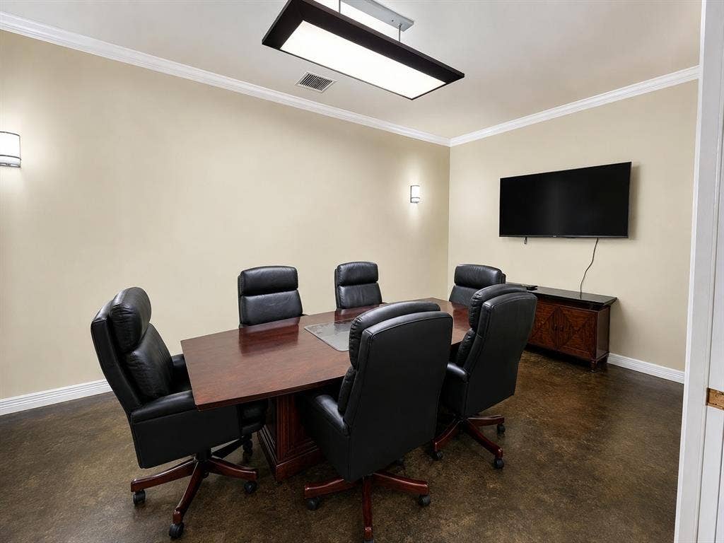 305 W Spring Creek Parkway, #5A, Plano, TX 75023 Conference room featuring a dark wood-finish table with six chairs, a wall-mounted display, and recessed wall sconces