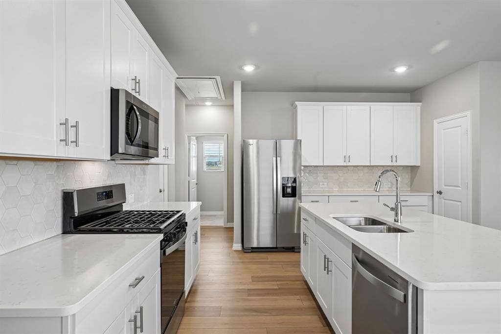 122 Winchester Hill Lane, Princeton, TX 75071 Photo is not of the actual home, but is an inspirational photo of builder’s model home and may depict options, furnishings, and/or decorator features that are not included.