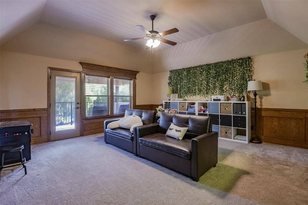 Gameroom is large space with natural light and door to outside deck.