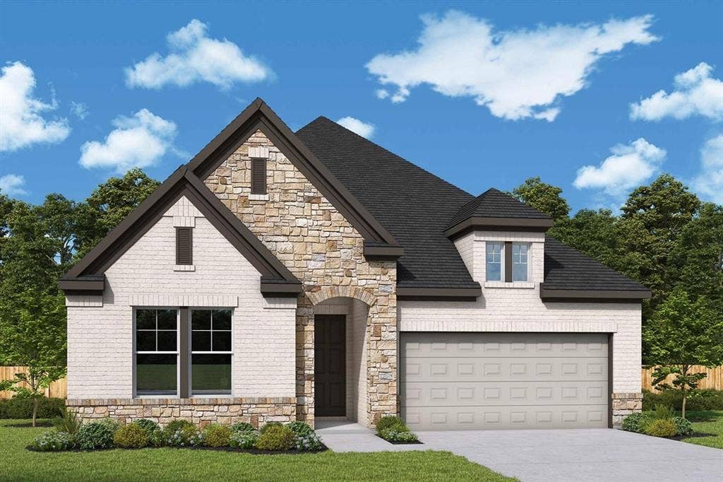 1359 Potenza Drive, Fate, TX 75087 Exterior featuring a mixed material facade of stone and light-toned brick, dark shingle roof, arched entry, two-car garage, and established landscaping