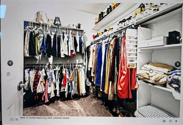 4220 Calla Drive, Forney, TX 75126 Walk-in closet featuring built-in shelving, hanging rods, and dark carpeting
