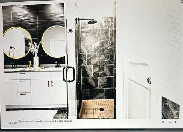 4220 Calla Drive, Forney, TX 75126 Double vanity with undermount sinks and contemporary gold-framed circular mirrors