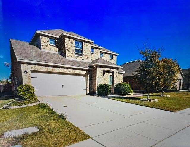 4220 Calla Drive, Forney, TX 75126 Brick exterior with a gabled roofline