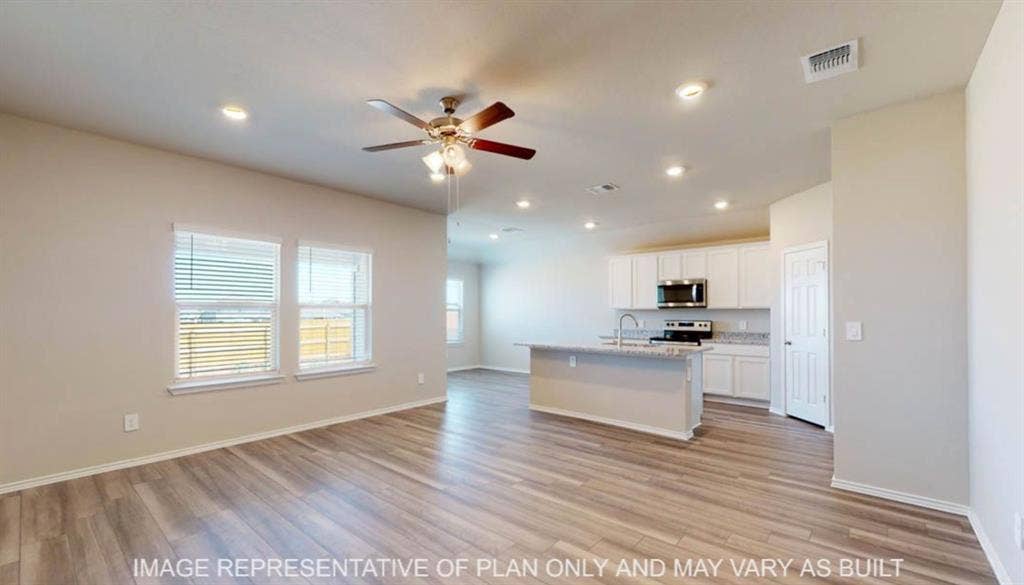10325 Altair Drive, Waco, TX 76708 Open-concept living space featuring wood-finish flooring, recessed lighting, and a ceiling fan