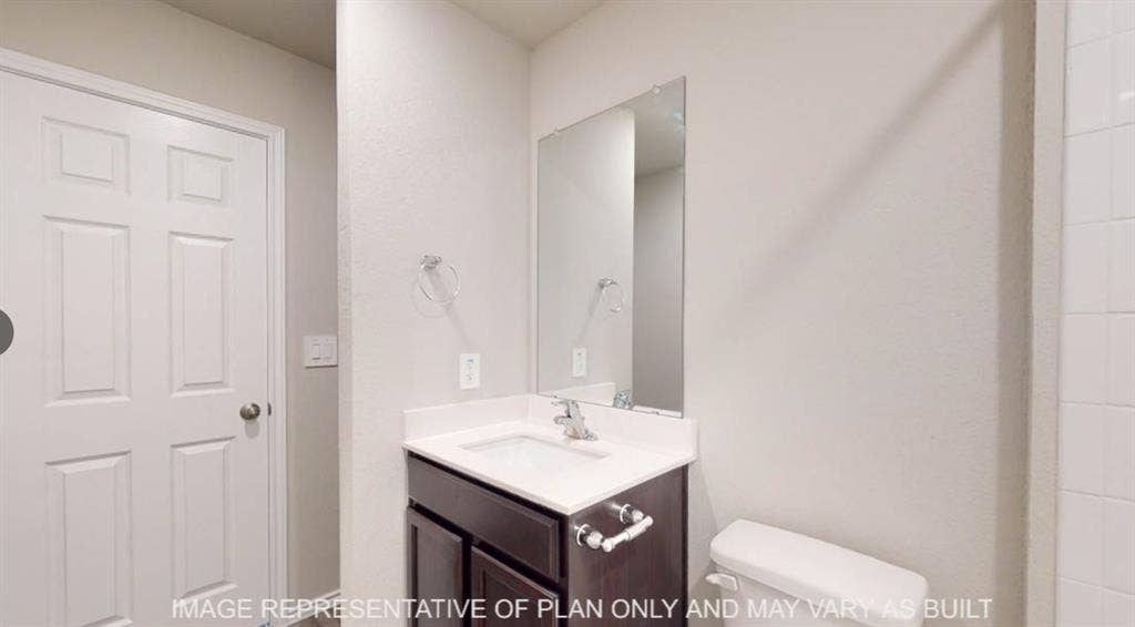 10325 Altair Drive, Waco, TX 76708 Bathroom featuring a dark wood-finish vanity with a white countertop and integrated sink