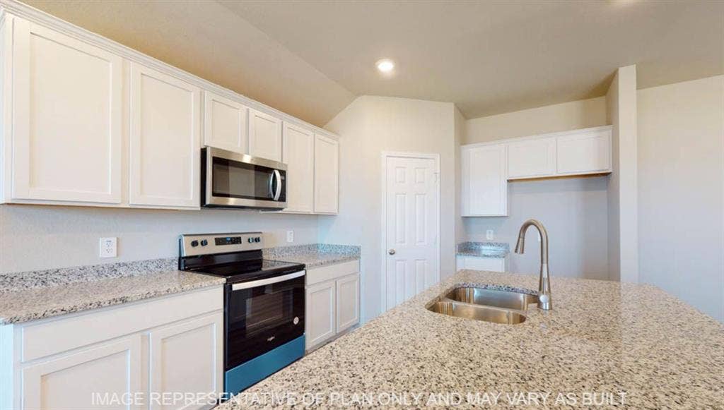 10325 Altair Drive, Waco, TX 76708 Kitchen featuring light-toned cabinetry, speckled countertops, stainless steel appliances, and a double basin sink with a gooseneck faucet