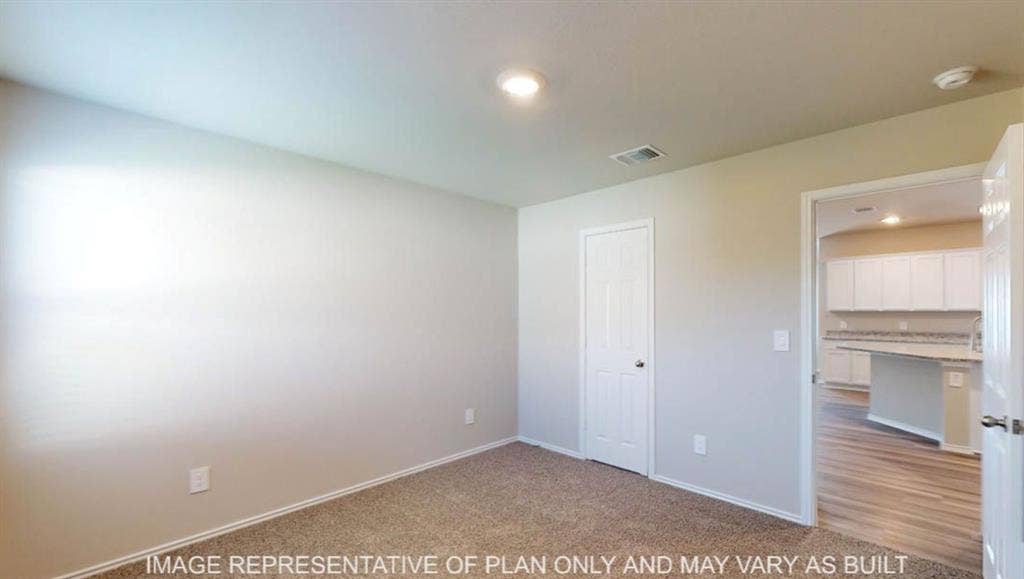 10317 Altair Drive, Waco, TX 76708 Carpeted room with neutral wall tones and white trim
