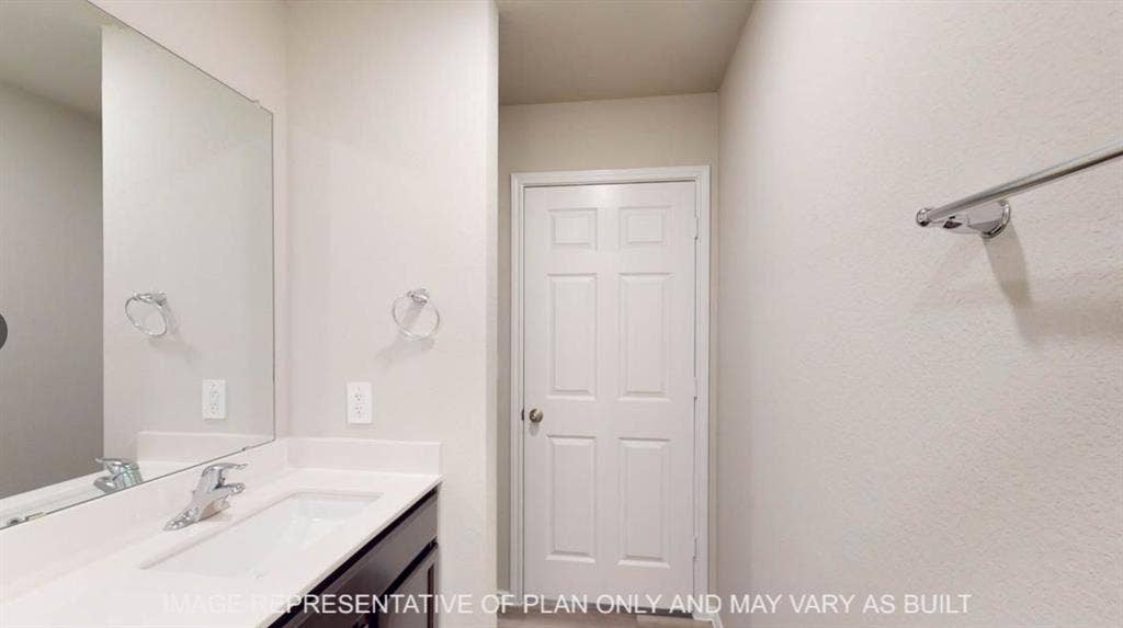 10317 Altair Drive, Waco, TX 76708 Bathroom vanity featuring a rectangular under-mount sink, chrome faucet, and expansive wall-mounted mirror