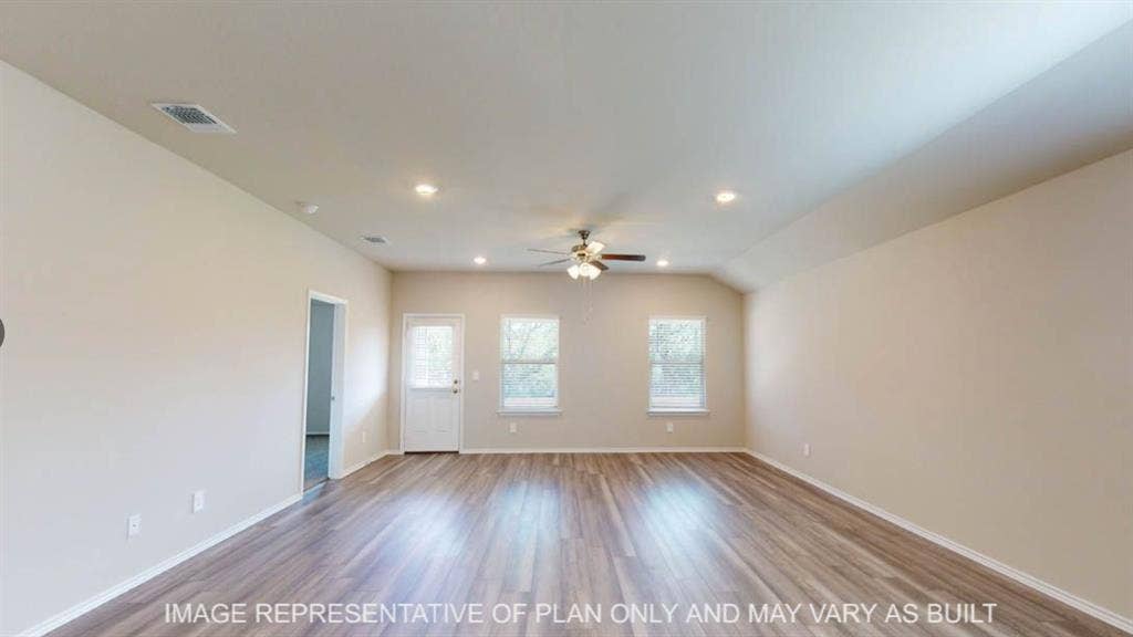 10317 Altair Drive, Waco, TX 76708 Spacious room featuring wood-finish flooring, neutral-toned walls, a ceiling fan, recessed lighting, and multiple windows