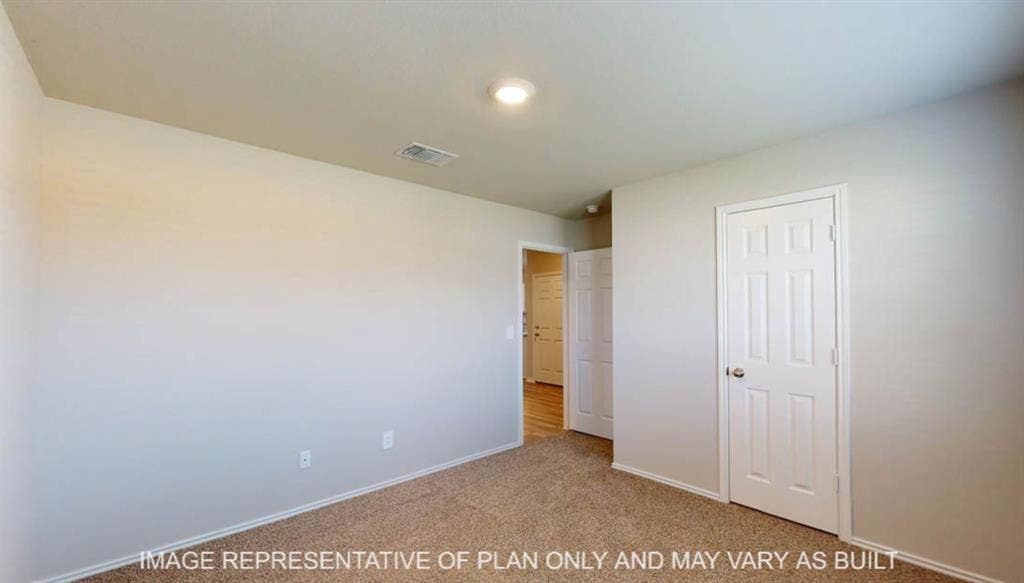 10317 Altair Drive, Waco, TX 76708 Carpeted room with light-colored walls and white trim